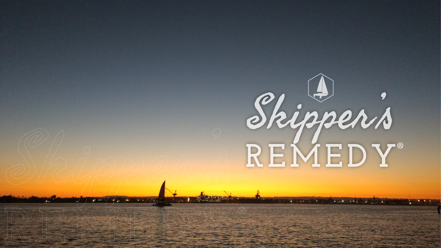 Catamaran sailing on the San Diego bay at sunset with 'Skipper's Remedy' logo