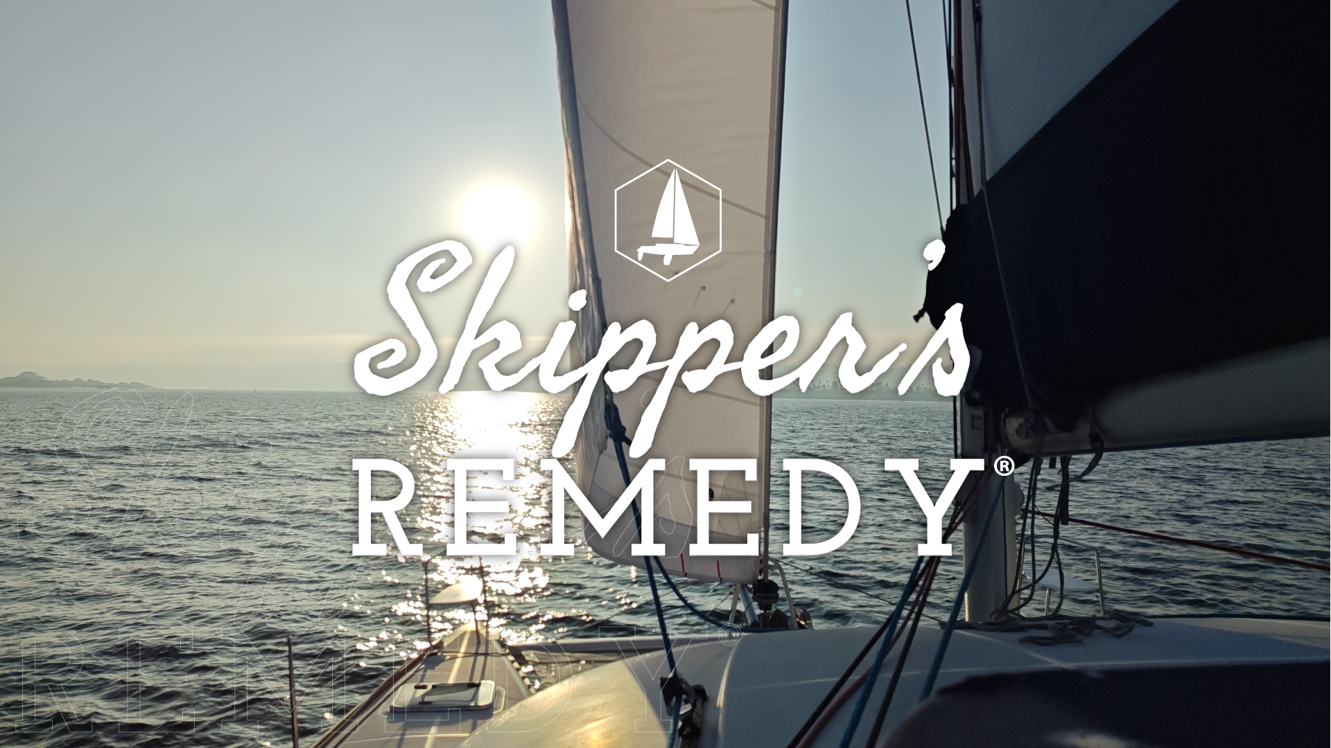 Sailing boat on the water with 'Skipper's Remedy' branding.
