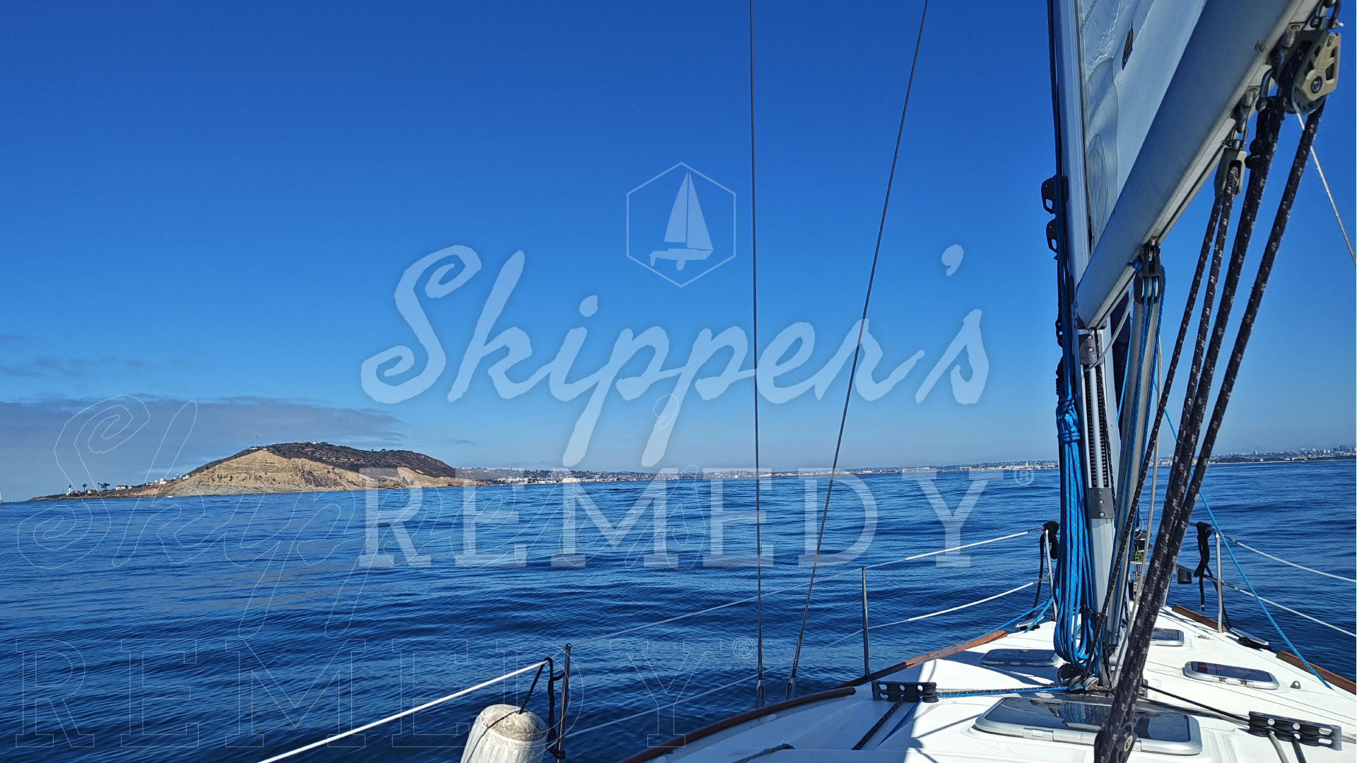 Sailing boat on the water with 'Skipper's Remedy' branding.